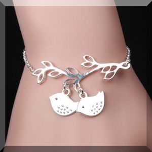 Twin Birds on a Branch Bracelet in Silver Tone . M